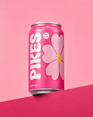Original pink Pikes Cherry Blossom can on a pink background.